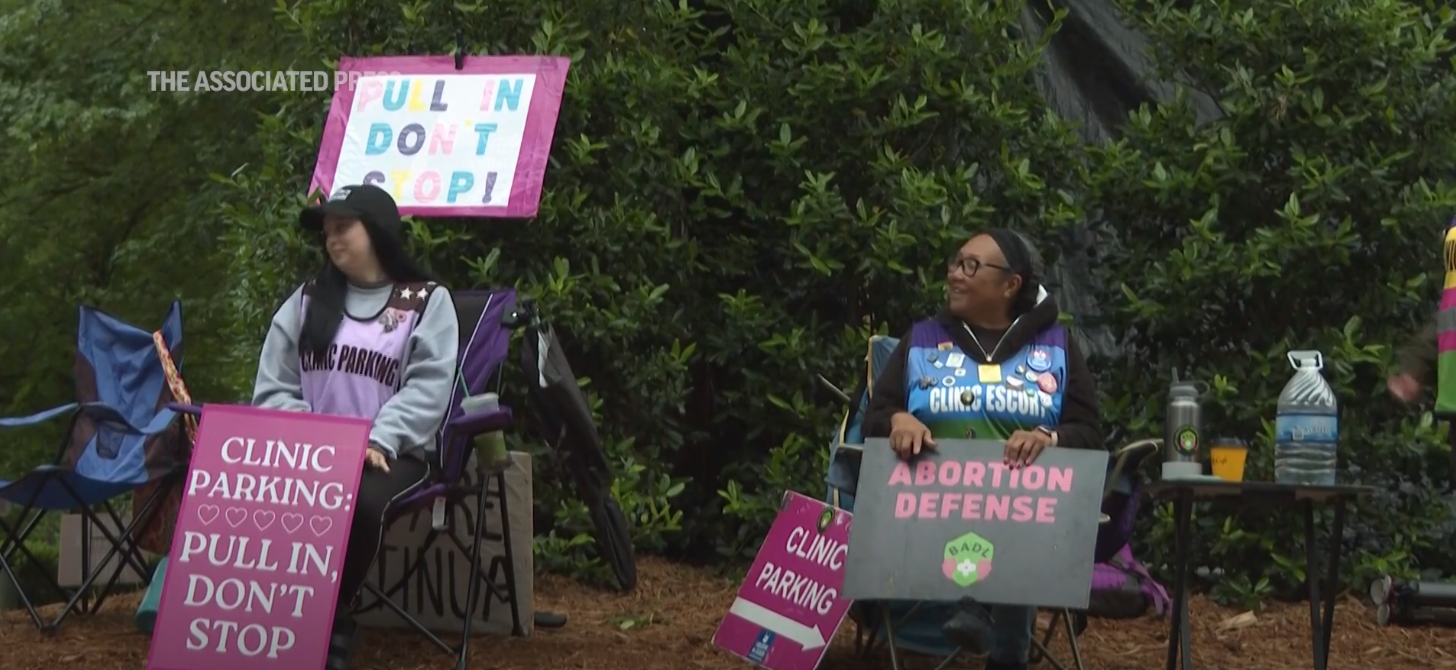 Activists with signs