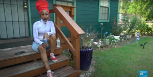 Nancy Davis sitting on stairs
